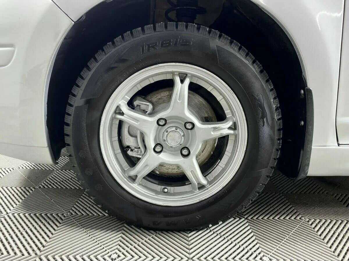 Nissan Tiida, 2011 Фото №16